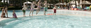 Kids jump in pool